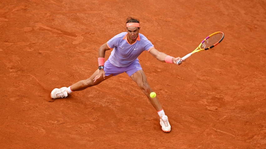 Nadal fights back to win opener in Rome