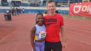 Williams and her Coach Phillip Unfried at the Velocity Fest Meeting at Jamaica College on Saturday.