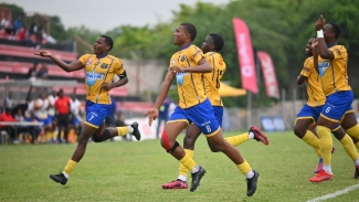 Clarendon College players celebrate a goal against Hydel High.