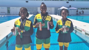 Jamaica&#039;s Artistic swimmers show off their awards.