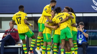 Jamaica&#039;s Reggae Boyz celebrate their goal against United States.