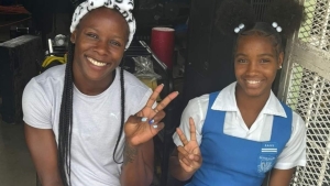 Jamaica&#039;s decorated athlete Shericka Jackson shares a photo opportunity with Dominican Kerelle Etienne