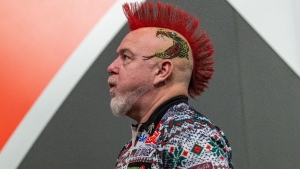 Peter Wright crashes out in New Zealand to truck driver Jonny Tata