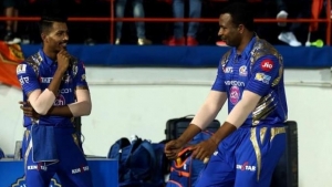 Pollard commiserates with teammate Hardik Pandya after loss to Royals