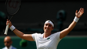 Wimbledon: Muguruza title hopes over as elated Jabeur stuns former champion