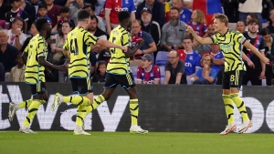 Martin Odegaard’s penalty earns 10-man Arsenal gritty victory at Crystal Palace