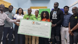 (from left) SDF&#039;s general manager Denzil Wilks; Urban Knights player Leslie Cassell; Alexier Archer-Clarke of Phoenix Health complex &amp; Vision Centre; Omar Palmer, Lasco&#039;s food &amp; beverage brand manager; Lasco&#039;s category manager, powdered beverages &amp; cereals, Renee Rose; Karonna Atkins of Gatorade, St George&#039;s Slayers player Adeeb Vernon; Matthew-Dane Henry of Upper Room Eagles and JABA president Paulton Gordon, share a photo opportunity with the SDF&#039;s symbolic $4 million cheque during the NBL&#039;s launch at SDF on Wednesday. 