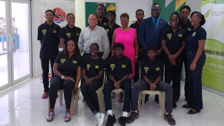 Members of Jamaica&#039;s CCCAN swim team share a photo opportunity with ASAJ president Martin Lyn (second row, third left), vice-president Georgia Sinclair (fourth left) and permanent  secretary in the ministry of sport, Dean-Roy Bernard (second row, fourth right), during a press briefing at the National Aquatic Centre on Thiursday.