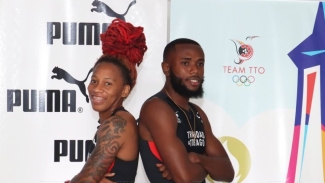 Michelle Lee Ahye and Elijah Joseph show off the T&amp;T Olympic gear during a reveal on Friday.