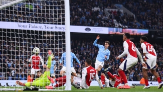 Man City 2-2 Arsenal: Stones late show denies 10-man visitors