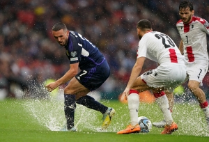 Scotland beat Georgia – and the weather – to move eight points clear in Group A