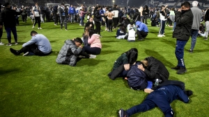 Boca Juniors game at Gimnasia abandoned, supporter dies after police and fans clash outside stadium