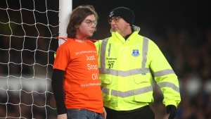 Everton v Newcastle game halted after protester attaches himself to goalpost