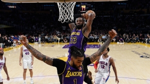 Russell sets Lakers record as Davis and LeBron hold off Sixers