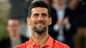 Novak Djokovic keeps focus on court to see off Marton Fucsovics at French Open