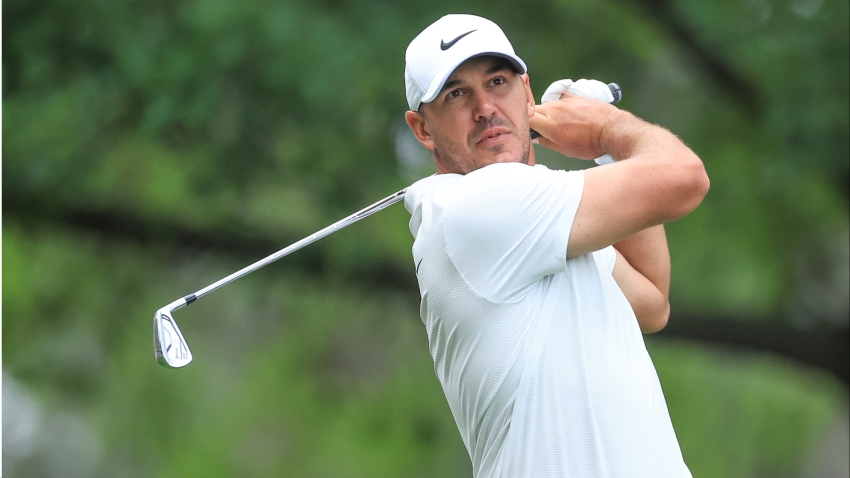 The Masters: Brooks Koepka opens up three-stroke lead before thunderstorm ends play
