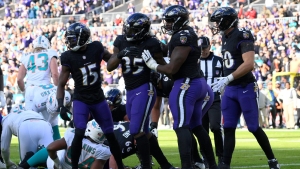Baltimore clinch AFC North title and top seed in play-offs with Miami mauling