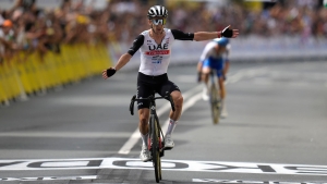 Adam Yates beats twin brother Simon to opening stage win and yellow jersey