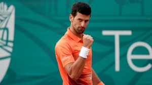 Djokovic battles back again to secure Belgrade semi