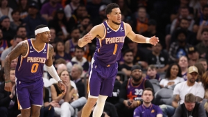 Booker scores 44 in Suns win after Durant&#039;s home debut delayed, Doncic injured as Mavs lose