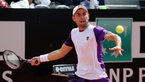 Karatsev saves match point to earn Djokovic meeting in Rome
