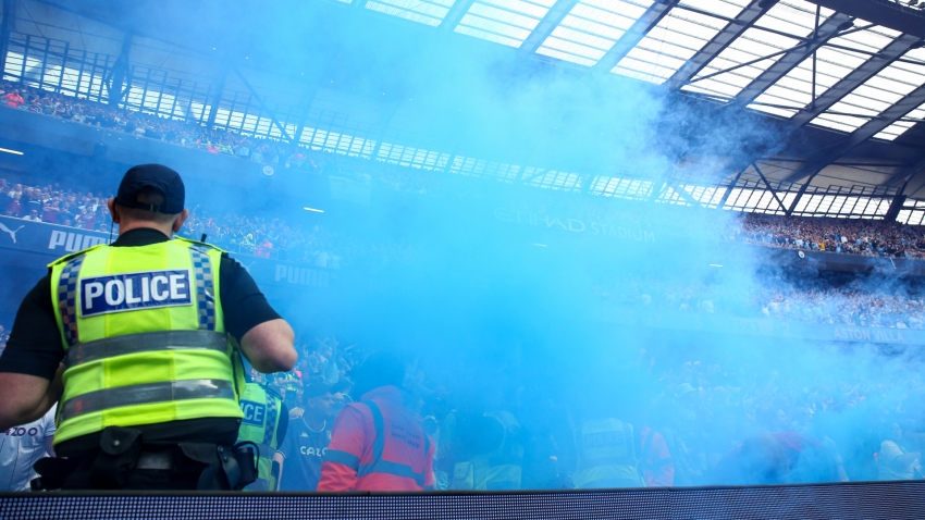 Two supporters charged after Man City pitch invasion