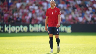 Manchester City’s Erling Haaland limps out of training while on duty with Norway