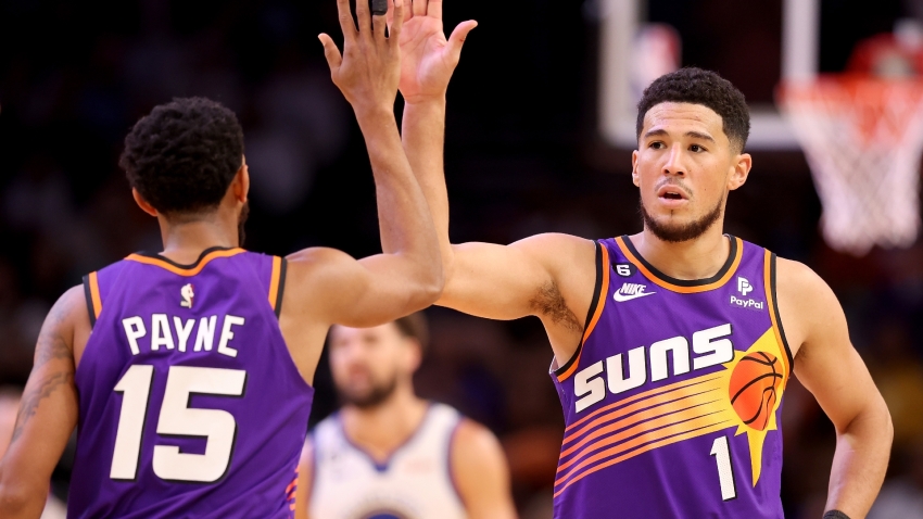 Booker stars again as Suns pile on points against Warriors, short-handed Pels down Doncic&#039;s Mavs