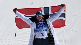 Winter Olympics: Johaug wins again while Great Britain clinch first gold