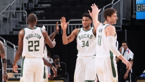 Giannis leads Bucks into playoffs with Nets win, Curry breaks more records