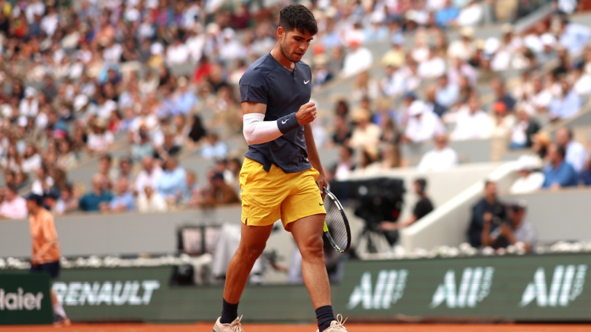 Alcaraz coasts into French Open second round after thrashing Wolf