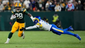 Dillon slams in two touchdowns to keep the Packers&#039; faint playoff hopes alive