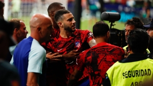 Atletico Madrid&#039;s Mario Hermoso has to be restrained after confronting his team&#039;s fans