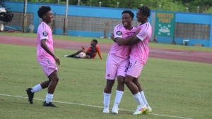 Bermuda players celebrate a goal.