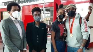TTOC Immediate past president Brian Lewis and First Citizens representative Trudy Louison with Afiya Bledman and Keston Bledman at Piarco International Airport on Thursday.