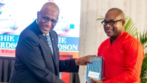 -  Sir Rodney Errey Lawrence Williams, GCMG, KGN, KStJ, Governor-General of Antigua and Barbuda (left) and the author of the book, Pro Vice-Chancellor and Principal Professor Densil A. Williams (right), share a light moment during the launch of his much-anticipated biography of former West Indies captain, Sir Richard Benjamin “Richie” Richardson.