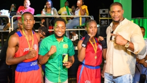 Errol Pusey (left), Pavel Smith Marketing Manager Wray &amp; Nephew along with Shanika Gordon and  Ricardo ‘Big 12’ Brown caught up during the Wray &amp; Nephew Fight Night held on Saturday October 7, 2023 at the  Ebony Vale Community Centre.