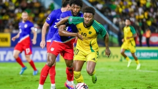 Jamaica&#039;s Demarai Gray tries to get away from United States defender Mark McKenzie.