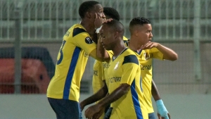 Defence Force players celebrate the equalising goal.
