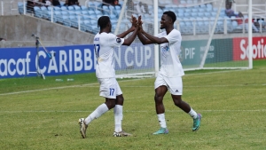 Mount Pleasant&#039;s scorer Jashaun Anglin (left) celebrates his goal with teammate Kyle Ming.