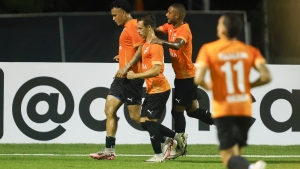 Cibao FC players celebrate a goal.