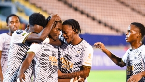 Cavalier players celebrate one of their many goals against Moca FC at the National Stadium.