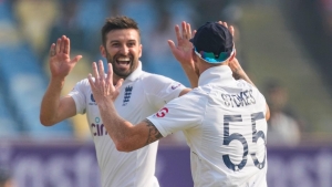 Mark Wood takes two wickets on England recall before India pair steady ship