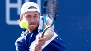 From brink of qualifying exit to second round, Pouille powers on at Winston-Salem