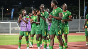 Grenada players celebrate their win.