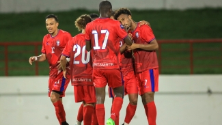 Saint Martin celebrate a goal against Saint Lucia.