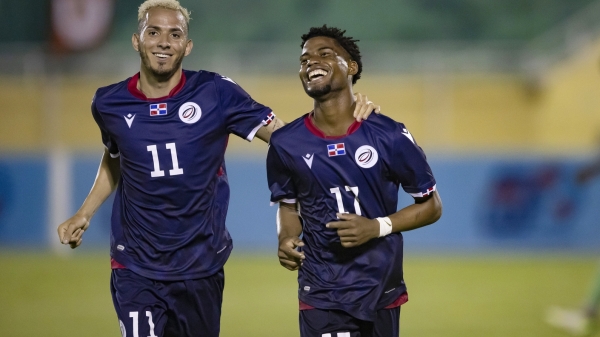 Dominican Republic&#039;s Dorny Romero (right) celebrates one of his two goals with a teammate.