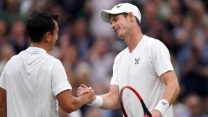 Wimbledon day two: Andy Murray puts on a show as rain decimates schedule
