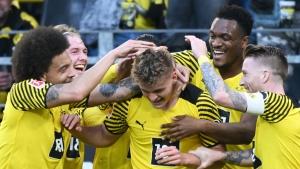 Rothe makes history as Dortmund cut gap to Bayern in style