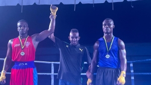 Former boxer and national coach Richard ‘Shrimpy’ Clarke shares the happy moment with Delano McLaughlin of the JDF Gym who won the final bout of the night of the start of competitive boxing for 2024 at the Stanley Couch Gym – under the Gloves Over Guns Futures Programme. McLaughlin defeated Kirk-Patrick Heron of the Port Antonio Gym in a light heavyweight match-up on Saturday night.